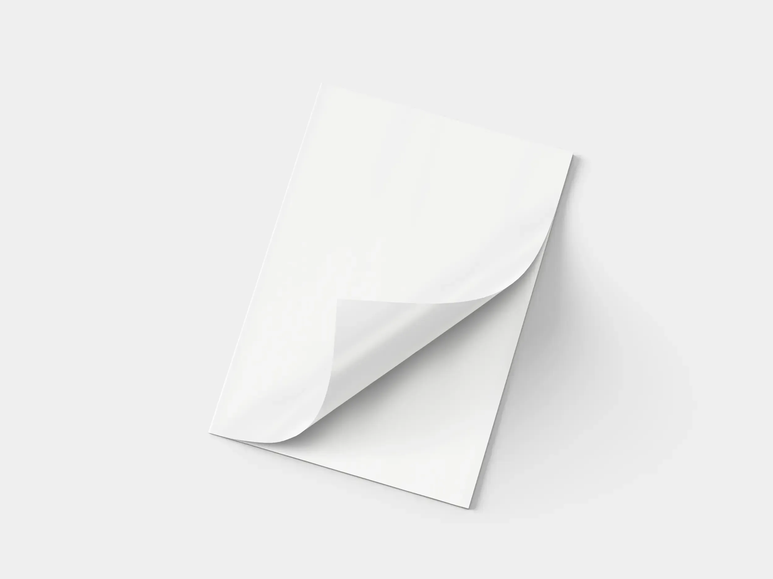 Gazetka reklamowa składana z częściowo zagiętym rogiem, prezentująca elastyczny papier i możliwość wielokrotnego składania. Mockup na jasnym tle podkreśla estetykę oraz funkcjonalność materiału promocyjnego.