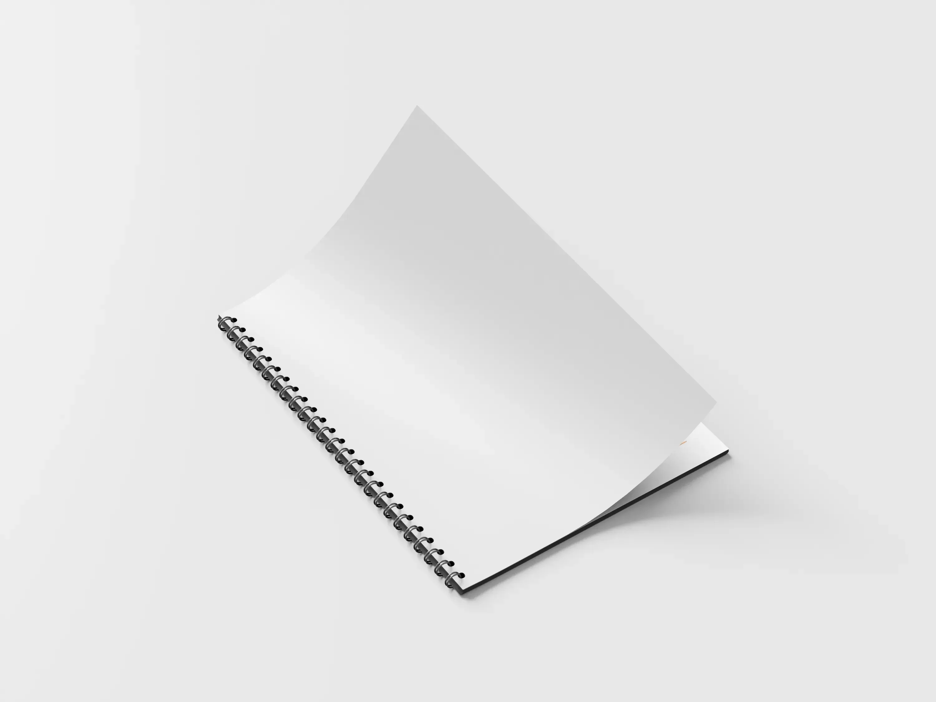 Katalog spiralowany z metalową spiralą i otwartą stroną, prezentujący wygodne przewracanie kartek oraz estetyczne wykonanie.